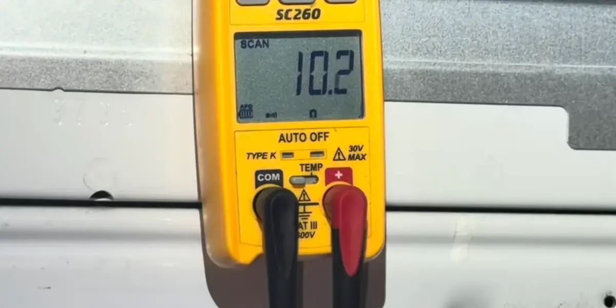 Multimeter testing a dryer heating element when a dryer is not heating