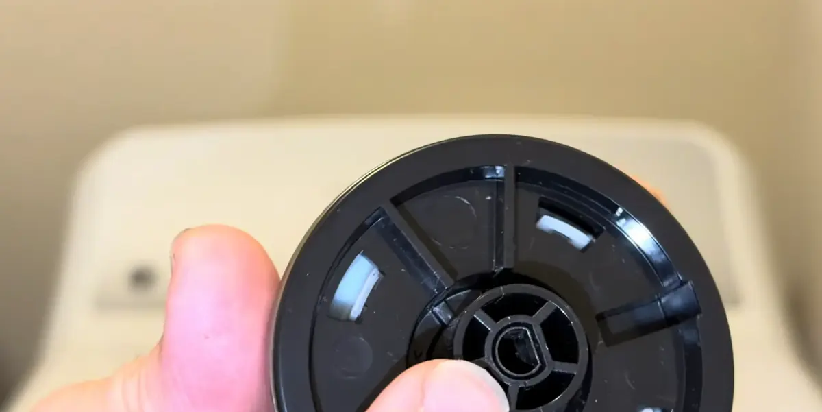 Split plastic insert in a GE dryer timer knob that stops the dryer from starting
