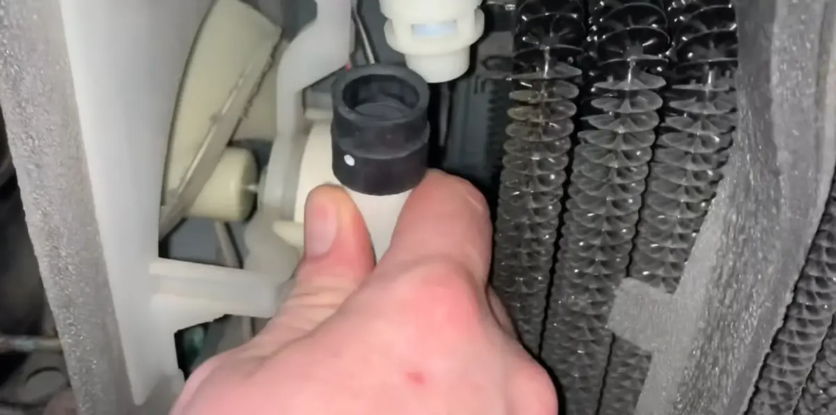 Defrost drain beside the evaporator coils during refrigerator repair in Bradenton